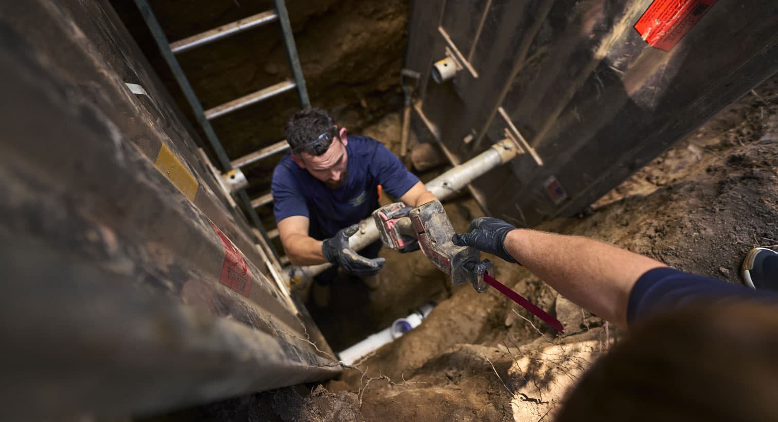 Tech inspecting sewer line