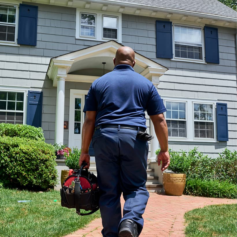 A Performance technician arrives at a home ready to provide expert HVAC, plumbing, and electrical services.