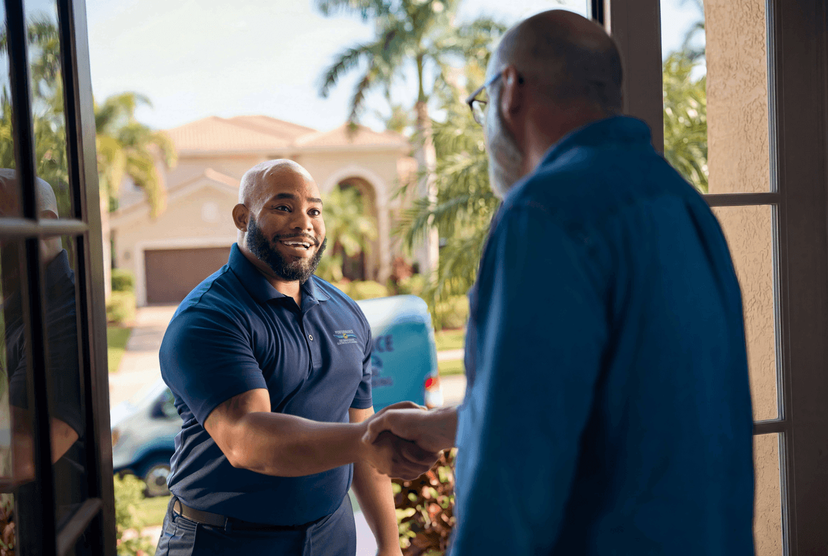 Technician shaking customers hand