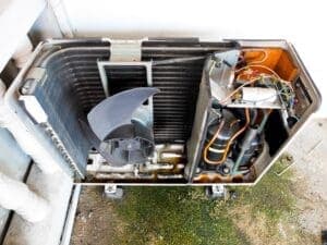 inside and air conditioner view of the fan blades and ac compressor